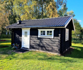 Mysig timmerstuga på dalagård